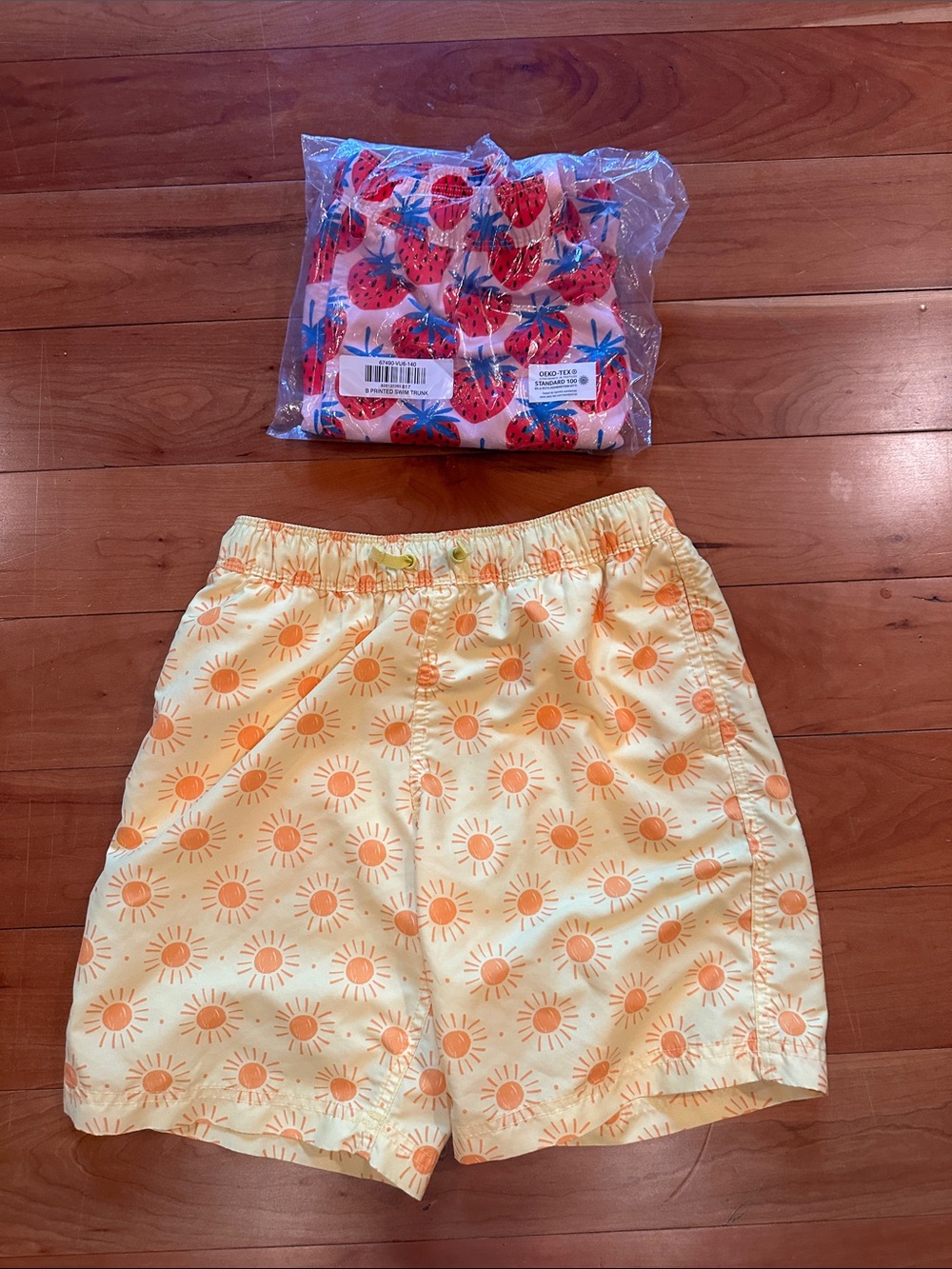 Two pairs of Hanna Andersson swim trunks Kids Size 10 - Suns and Strawberries
